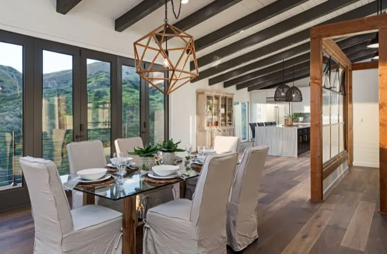 a dining room with brown, gray, and copper accents